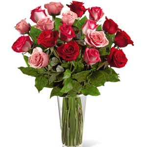 This premium rose gift features eighteen gorgeous long-stem beauties in romantic red and pink hues designed with fresh foliage in a handsome glass vase. It?s a sure-fire way to start a fire!  Florist delivery in the USA and Canada.