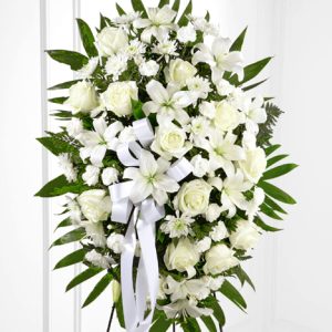 Soften the sorrow with this gorgeous arrangement of white roses