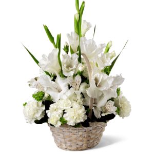 Send your heartfelt thoughts and condolences with this thoughtful table arrangement of peaceful white blossoms designed in a natural basket. Featured flowers include glads