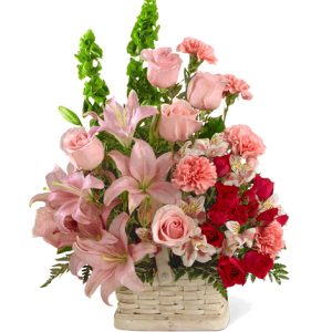 Express your sincerest sympathy and support with this popular floral basket bouquet in pretty pink hues. Featured flowers include roses