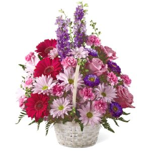 A pretty pink and lavender mixed basket bouquet to show how much you care. Featured flowers include roses