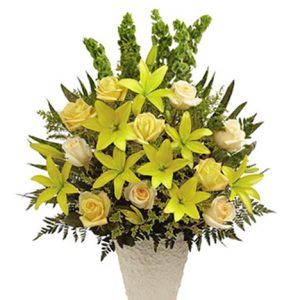 Express your deepest sympathy and fondest memories with this uplifting funeral flowers tribute featuring lilies