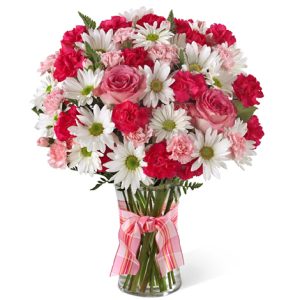 Send a sweet surprise with this fresh combination of daisy poms