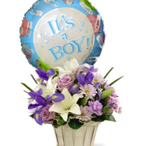 Welcome the new arrival with this sweet basket bouquet of fresh seasonal blooms in baby boy purple