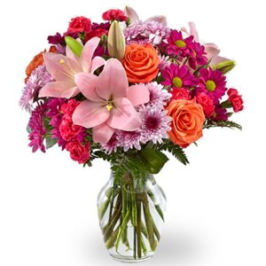 Brighten the day with this uplifting bouquet of fresh garden blooms in pretty pink