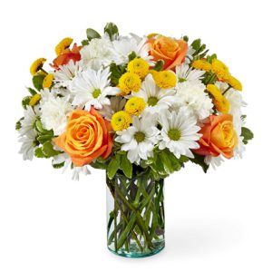 Brighten anyone's day with this cheery bouquet of refreshing white daisy poms