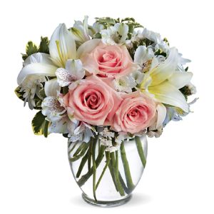 Send a gift that always arrives in style with this lovely pink and white bouquet of fresh roses
