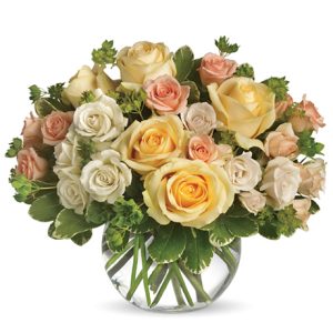 A beautiful combination of assorted fresh roses and miniature roses in soft yellow