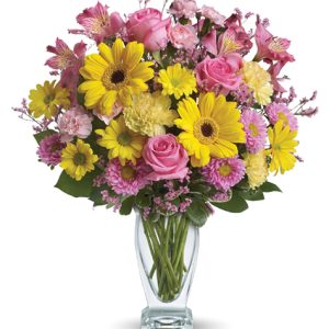 Dazzle someone on with this glorious celebration of pretty pink and yellow flowers designed and delivered in a stylish glass vase. Featured blooms include Gerbera daisies
