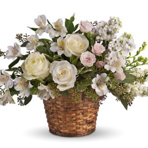 Send your warmest sympathy wishes to the home or funeral service with this distinctive table arrangement of assorted fresh flowers