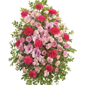 Convey your heartfelt sympathy and support with this soft and pretty pink standing spray of fresh carnations
