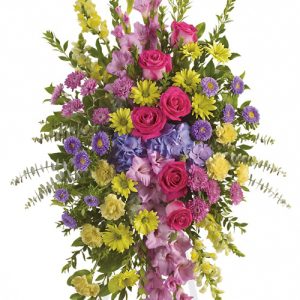 This popular sympathy spray reflects the many colors of life with a rich spectrum of beautiful blooms to honor a cherished loved one. Featured flowers include gladioli