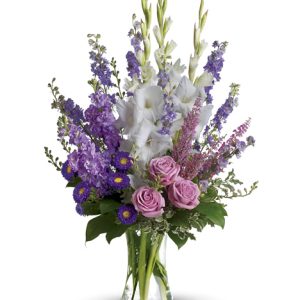 This dramatic arrangement features garden fresh flowers in a wonderful assortment of pretty pink