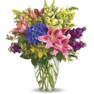 A stunning collection of colors and textures designed in a clear glass vase