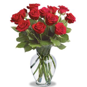 One dozen beautiful roses tastefully designed with fresh foliage in a quality glass vase and delivered fresh by our network of professional local florists. Available in most areas in red