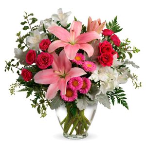 This pretty fresh flower bouquet features spray roses