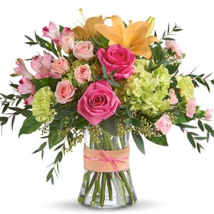 Send smiles across miles with this delightful design of fresh garden blooms in pretty pink