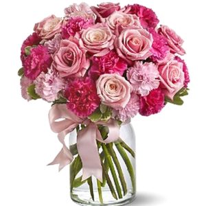 An irresistible combination of assorted pink roses and fresh carnations designed in a glass vase. Just perfect for Valentine's