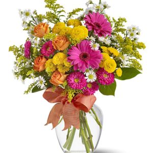 Send your warmest wishes with this colorful assortment of garden fresh flowers in cheery pink