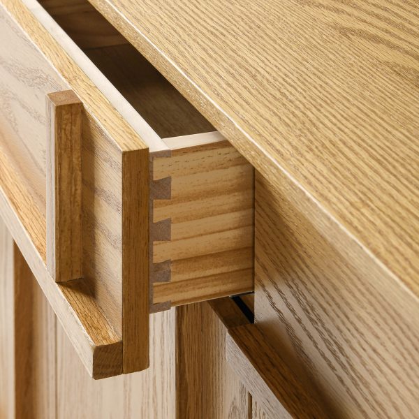 providing structural integrity while echoing a retro style. Sideboard has 4 dovetailed drawers and 2 cabinets with adjustable shelves