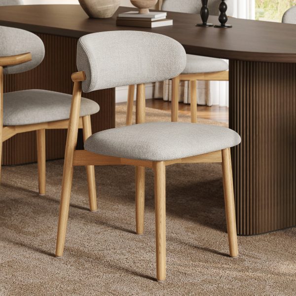 Add comfort & style to your dining space! This elegant wood dining chair features an ash frame
