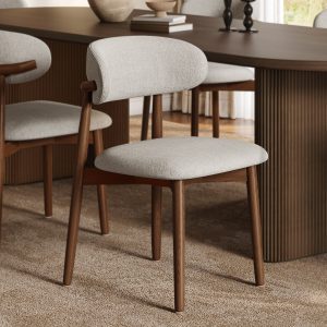 Experience comfort & elegance with this upholstered dining chair. Its solid ash wood frame