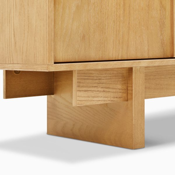 providing structural integrity while echoing a retro style. Credenza has 4 dovetailed drawers and 2 cabinets with adjustable shelves