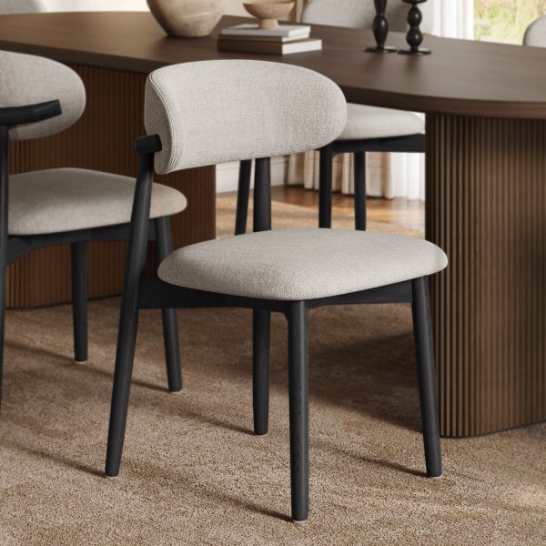 Upgrade your dining experience with this contemporary dining chair. Its ash wood frame