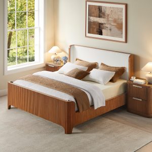 a beautifully handcrafted piece made from solid oak with refined vertical slat detailing that brings texture and architectural elegance. The softly curved headboard is upholstered in plush