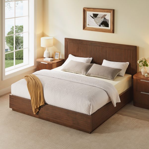 a beautifully crafted piece made from solid acacia wood and finished with rich walnut veneer. Vertical fluted detailing across the headboard and footboard adds depth and architectural interest