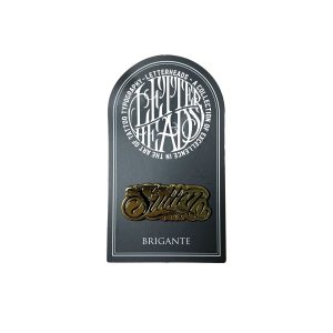 <p>Grab this gold collectable Letterheads Pin with lettering by artist Brigante!  </p> <ul> <li> <span>LETTERHEADS #4 - Brigante Tattoo -  @brigantetattoo </span> <br> </li> </ul>