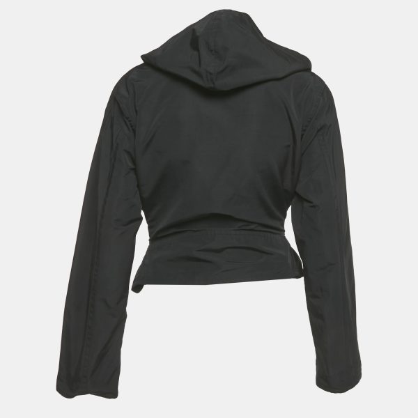 this Alaia hooded biker jacket features a wrap around design in sleek black synthetic leather. Structured yet versatile