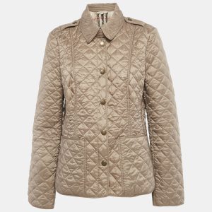 Burberry offers modern utility with this quilted long sleeve jacket in light brown nylon. The lightweight build ensures versatility across seasons