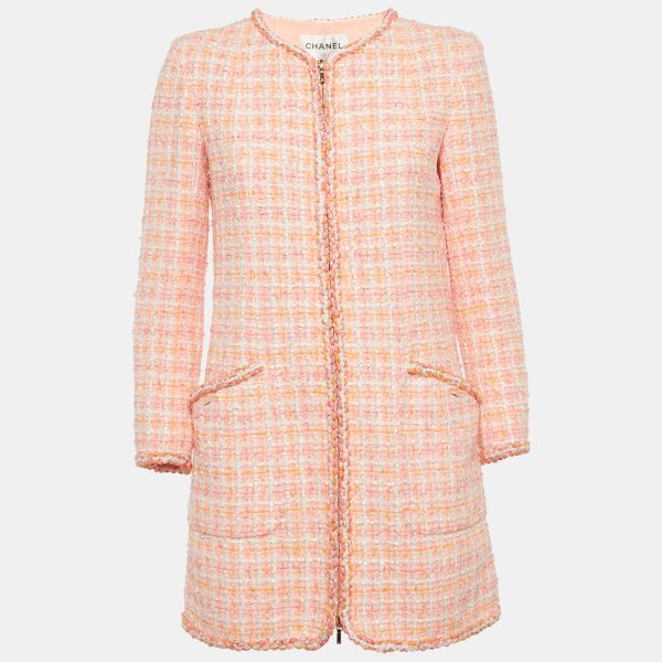 Chanel’s pink tweed fantasy jacket embodies the maison’s iconic textile reinterpreted with a playful hue. Structured seams and signature trim nod to the house’s couture heritage. Throw it over denim for modern contrast or wear with a matching skirt for full Parisian polish.