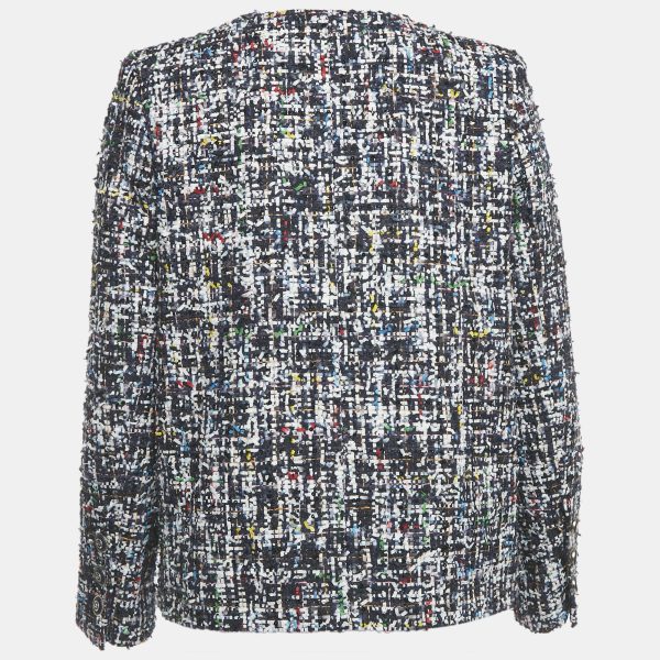 giving it a textured depth. Ruffles trace the buttoned front