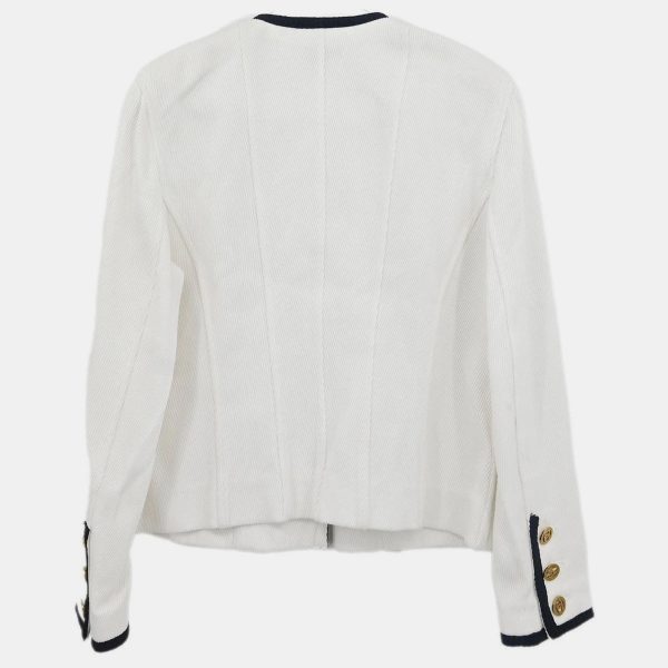 this Chanel single breasted jacket in white exudes timeless elegance. Its collarless silhouette softens the sharpness of tailoring