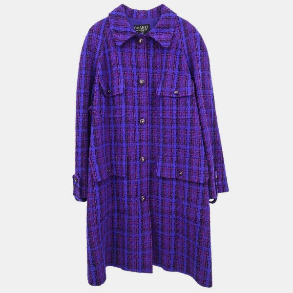 This Chanel coat channels the confident minimalism of the era with a palette rich in royal intent. The tailored structure is softened by its lush