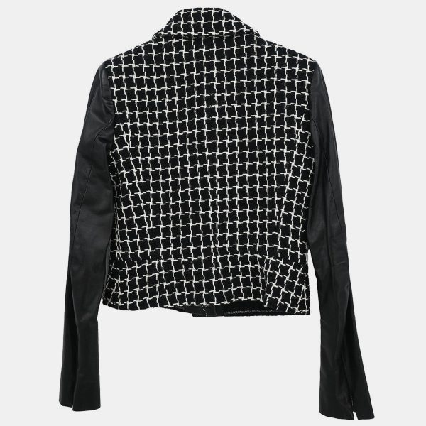 this Chanel jacket is the kind of piece that anchors a wardrobe. Rendered in classic black