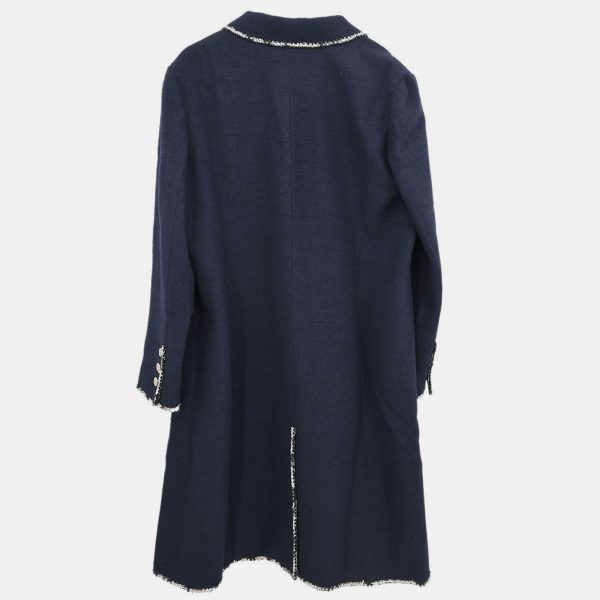 this Chanel jacket from the 2005 Cruise collection walks the line between maritime chic and Parisian polish. Crisp yet fluid