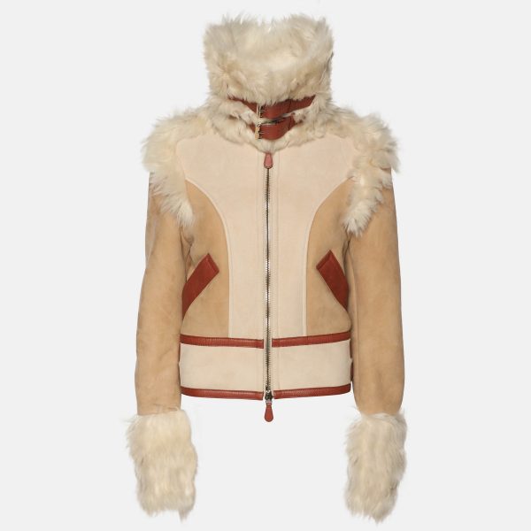 blending plush shearling with smooth leather. The zip up silhouette balances practicality with Parisian chic. An essential for transitional wardrobes