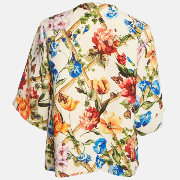 while the print embodies the house’s romantic aesthetic. A standout layer for sophisticated ensembles.