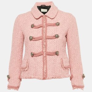 Gucci revisits the heritage jacket in pink tweed with a button front closure that channels retro chic. Textural fabric and signature details give a nod to the house’s maximalist streak while staying refined. Wear it with tailored pants for the office or over a slip dress for an eclectic high low mix.