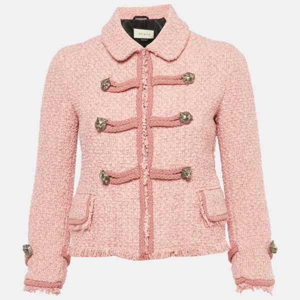 Gucci revisits the heritage jacket in pink tweed with a button front closure that channels retro chic. Textural fabric and signature details give a nod to the house’s maximalist streak while staying refined. Wear it with tailored pants for the office or over a slip dress for an eclectic high low mix.
