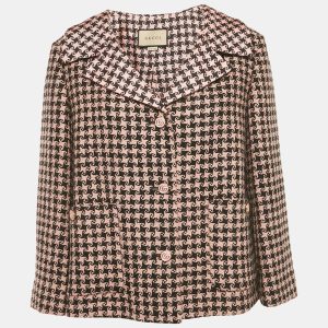 Gucci brings a bold color mix to tailoring with this oversized tweed blazer in pink and black. Finished with wide lapels and branded buttons
