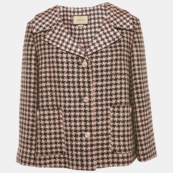 Gucci brings a bold color mix to tailoring with this oversized tweed blazer in pink and black. Finished with wide lapels and branded buttons