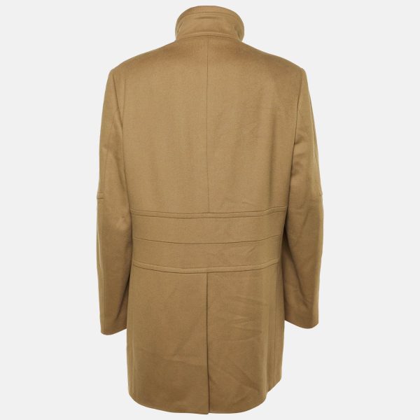 rendered in warm brown wool. The button front design and structured cut bring timeless refinement