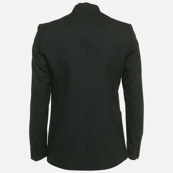 this Maje blazer stands out with silk trimmed lapels that give a play of matte and sheen. The single button front and patch pockets keep the design unfussy