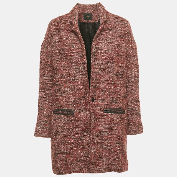 Maje’s Gordan coat is crafted in red tweed with leather trims on its pockets. The mid length cut offers coverage while maintaining movement