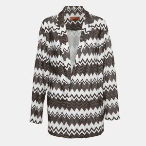 Missoni reworks the blazer with bold zig zags and an oversized cut that feels both laidback and sharp. It’s a statement layer that can slip over denim