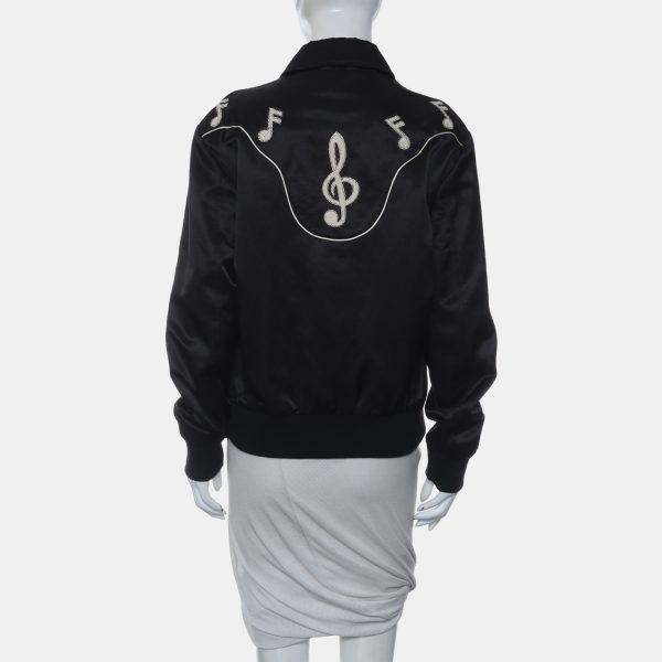 where music is more than a motif—it’s a mood. Intricately detailed notes dance across the fabric